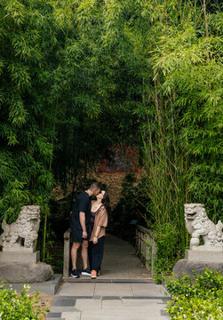 A young couple out for a walk in the park