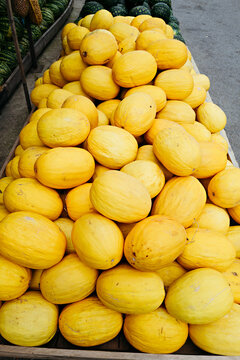 Vibrant Yellow Melons Brightening the Market Scene