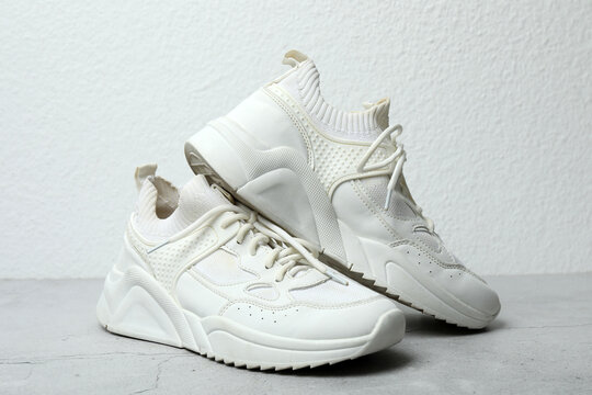 A close-up of a pair of stylish sneakers.
