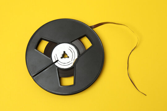 A video cassette against a colored background. An old analog VHS cassette, close-up. Retro and vintage.
