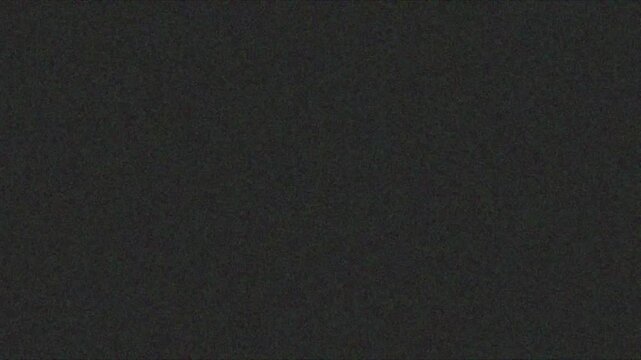 Dark gray analog film grain texture overlay with subtle noise background