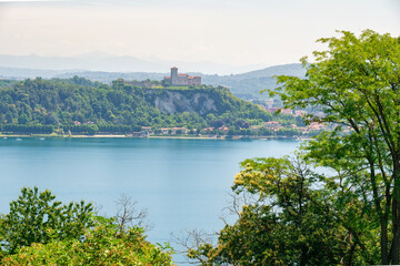 Fototapeta premium Rocca di Angera medieval castle atop cliff overlooking Lake Maggiore