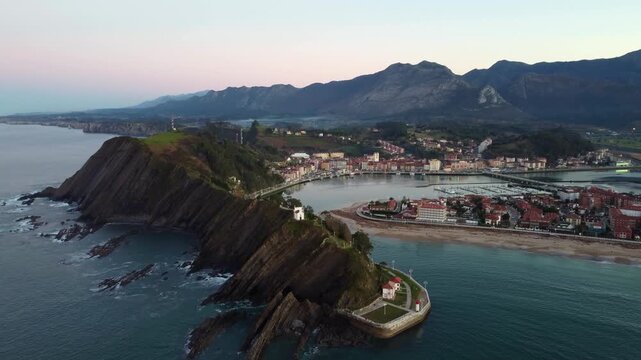 Aerial view of Ribadesella and its estuary at sunset in Asturias, Spain.