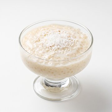 Traditional Brazilian Cuscuz Coconut Tapioca Pudding In Glass Dessert Bowl.