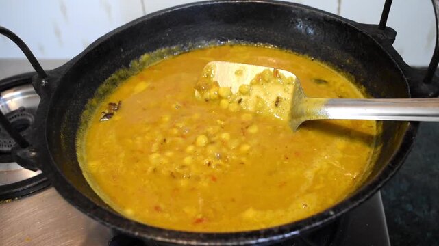 preparing homemade yellow toor dal