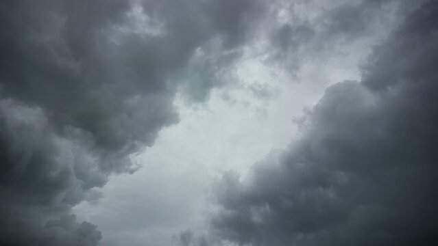 Ominous grey rain clouds covering the overcast sky