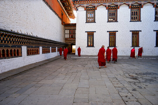 Bhutan, Thimphu - Buddhist monks in their red robes at the Trashi Chhoe Dzong	