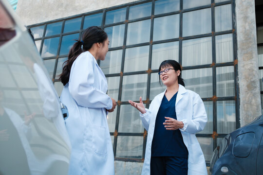 Female medical professionals having a discussion outdoors