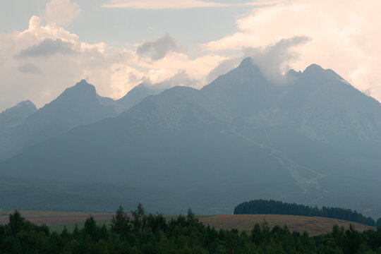 high tatras mountain range peaks including lomnicky stit, gerlachovsky stit in slovakia landscape view rocky summits cloudy sky concept of travel, tourism, nature