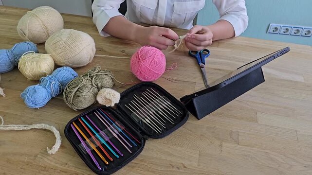 Crafting with yarn and tools in a cozy workspace
