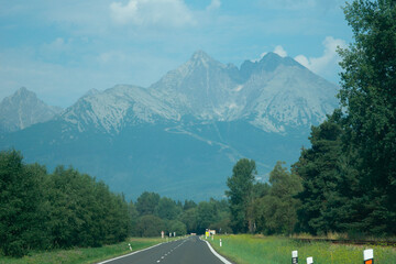 Fototapeta premium lomnicky stit mountain peak in slovakia high tatras landscape view green forest nature rocky summit concept of travel, tourism, nature