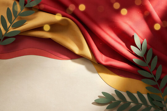 Red and gold silk fabric with paper cut olive branches on beige background, Spain National Day flat lay with copy space