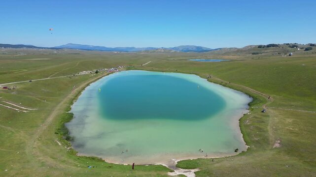 Drone View of Devil's Lake (Vražje Jezero)  in Durmitor, Montenegro Surrounded by Mountain Landscape