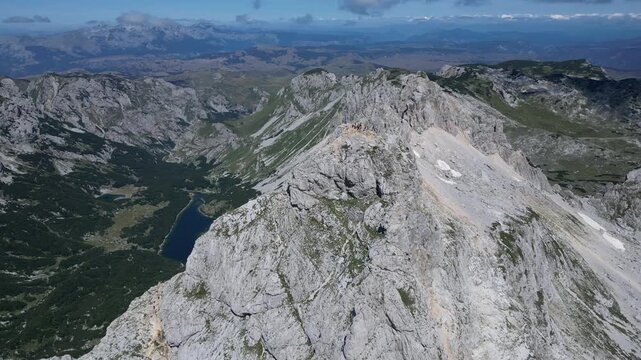 Drone View of People Standing on Bobotov Kuk Peak in Durmitor National Park, Montenegro, UNESCO World Heritage Site