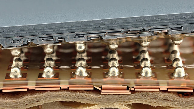 Microscopic view of flip chip bonding with solder bumps connecting die to substrate in advanced semiconductor packaging interconnect