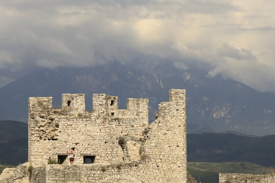 Berat Castle ancient stone walls and battlements, historical architecture and cultural heritage in Albania, mountain landscape background