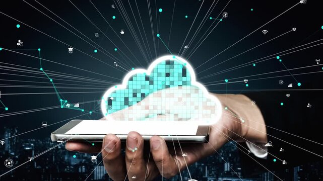 A creative representation of cloud computing showing a hand holding a smartphone with digital cloud symbols surrounded by network connections against a dark city backdrop. Xenic