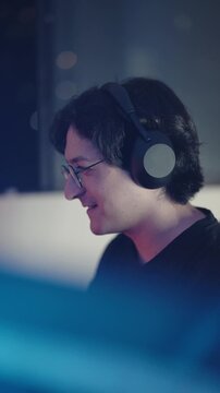Young Male Gamer Playing Video Games in RGB Neon Gaming Room