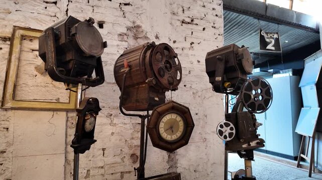 Vintage Film Studio Spotlights and Antique Cinema Equipment on Industrial Wall
