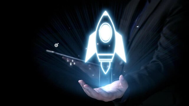 A glowing rocket icon held in a hand symbolizes innovation and growth in technology and business. This image reflects concepts of success, creativity, and new beginnings. Qubit