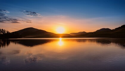 Fototapeta premium Peaceful Sunset Reflection On A Calm Lake With Silhouetted Hills
