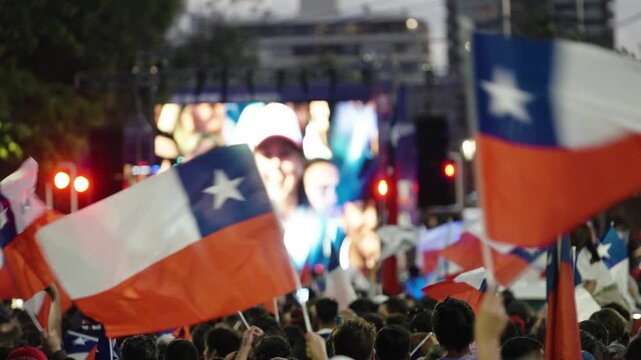 Supporters Wave Chilean Flags During Celebration After Jos&eacute; Antonio Kast Presidential Election Victory in Chile
