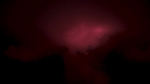 Aerial view of fireworks display over the ocean at dusk near a coastal city Valparaiso City