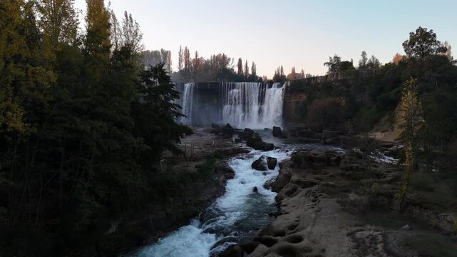 Waterfall and Rushing Rapids Flowing Through the Verdant Forest at Salto del Laja, Chile 