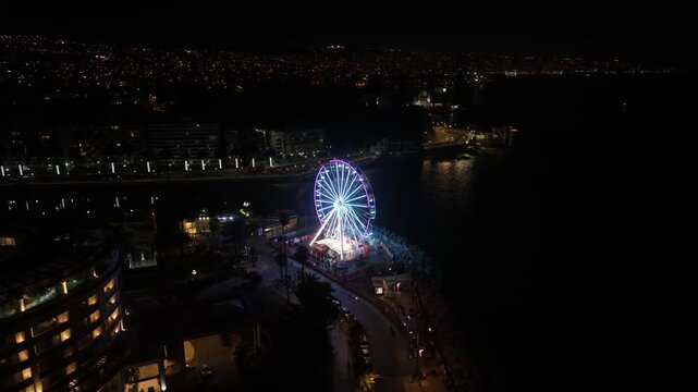 Aerial View of Illuminated Ferris Wheel at Night in Vina del Mar, Chile