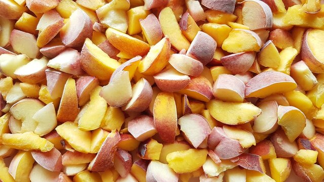 Frozen peach slices. Fruit background.