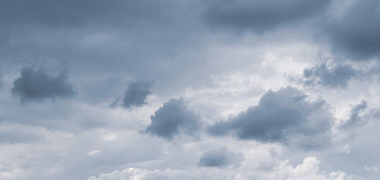 Overcast sky with thick gray clouds before rain, panoramic view of gloomy weather