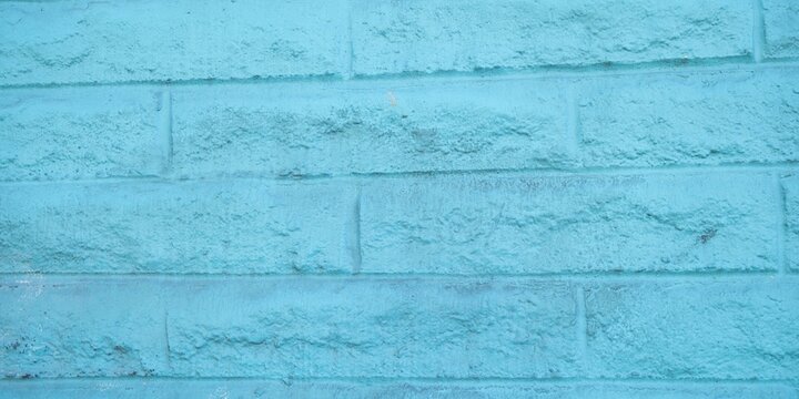 Light blue painted cinder block wall texture background