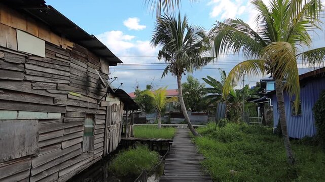  Fishing village houses over the water garbage poor areas in Sabah province in Malaysia