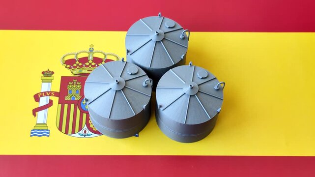 Liquefied gas storage tanks set against the Spanish flag, as a background for your design