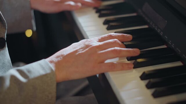 Closeup of hands playing piano. Intimate scene of hands crafting nuanced musical phrases. Closeup shot capturing hands executing expressive piano passages with mood and tonal sensitivity
