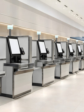 Modern Self Checkout Machines in Bright Empty Retail Store