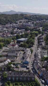 Vertical establishing aerial view of Bangor, city in the north of Wales, United Kingdom