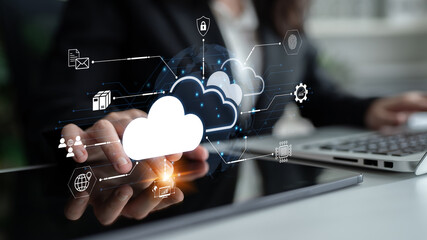 Obraz na płótnie Canvas Business professional engaged in cloud technology with digital icons representing data transfer, security, and connectivity. Bitwise.