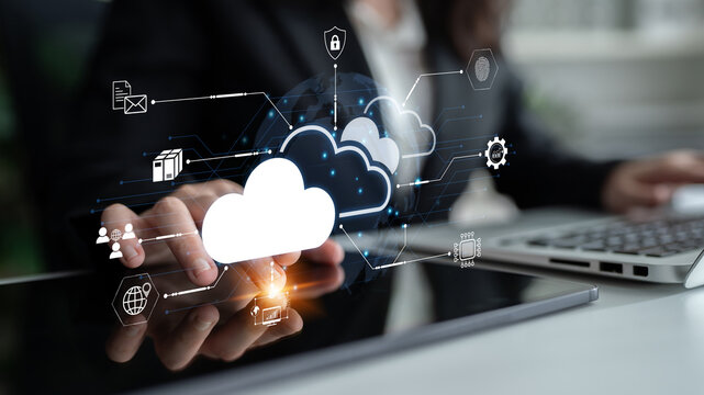 Business professional engaged in cloud technology with digital icons representing data transfer, security, and connectivity. Bitwise.