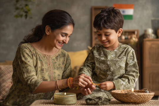 Beautiful Raksha Bandhan festival celebration featuring a loving brother and sister celebrating the sacred bond of siblings, with traditional rakhi, festive decorations, gifts, sweets, and a warm fami