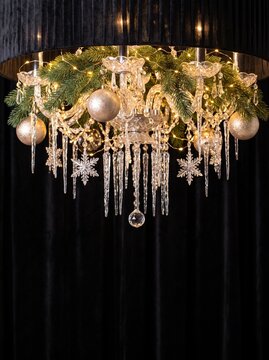 Elegant Festive Chandelier Decorated with Pine Branches and Ornaments