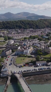 Vertical establishing aerial view of Bangor, city in the north of Wales, United Kingdom