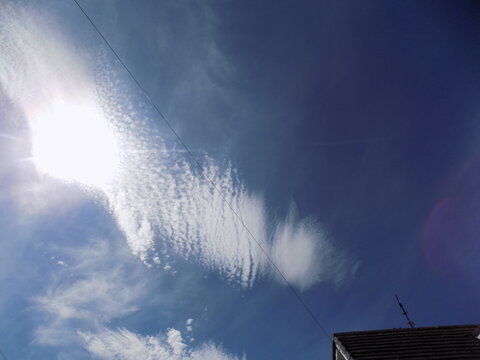 Sun behind Kelvin- Helmholtz cloud formation