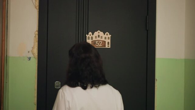 Doorway interaction shifts from anxiety to mutual understanding and reassurance. Initial tension during welfare check eases as dialogue promotes trustful communication and calmness