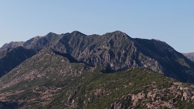 Rugged limestone mountain ridges in warm evening light, southern Albania