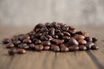 Fototapeta premium Coffee beans pile on modern background