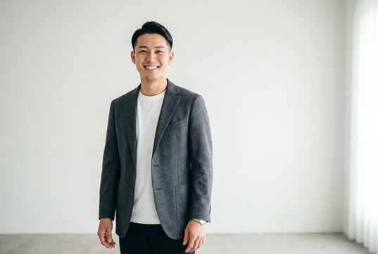 ジャケット姿で微笑む若い男性 Generative AI