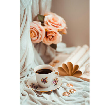 cup of coffee and rose
