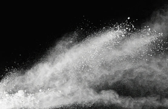 White powder explosion on black background