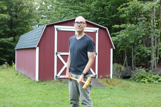 man with croquet mallet